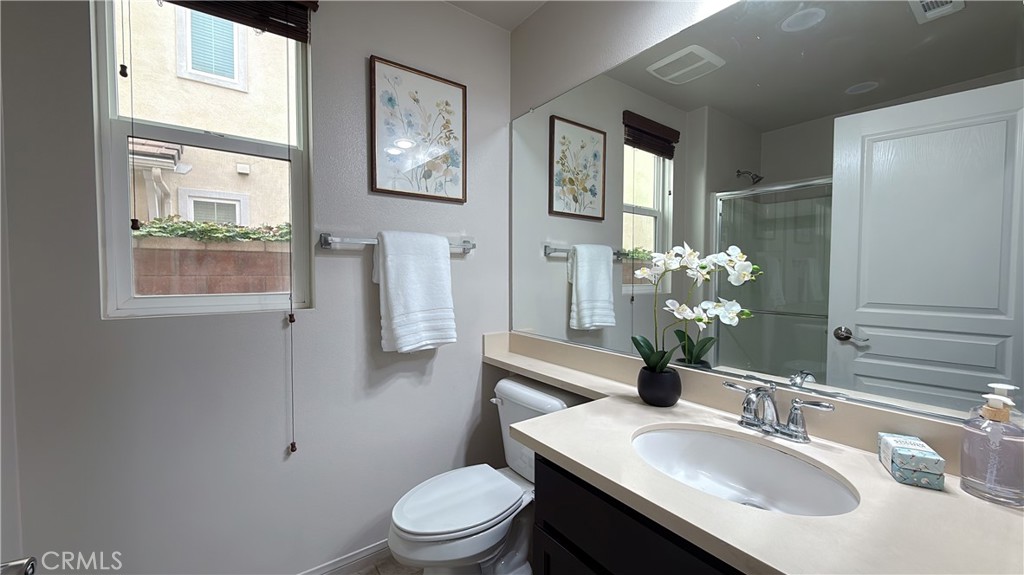 7833 Wild Rye Street Chino, CA 91708 - Photo 24 of 44 a bathroom with a sink toilet and mirror