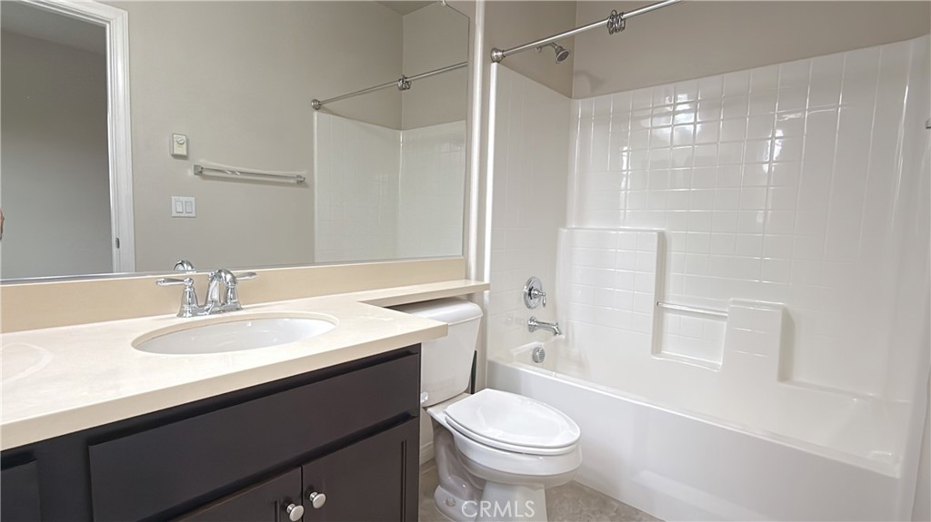 7833 Wild Rye Street Chino, CA 91708 - Photo 27 of 44 a bathroom with a sink a toilet and shower