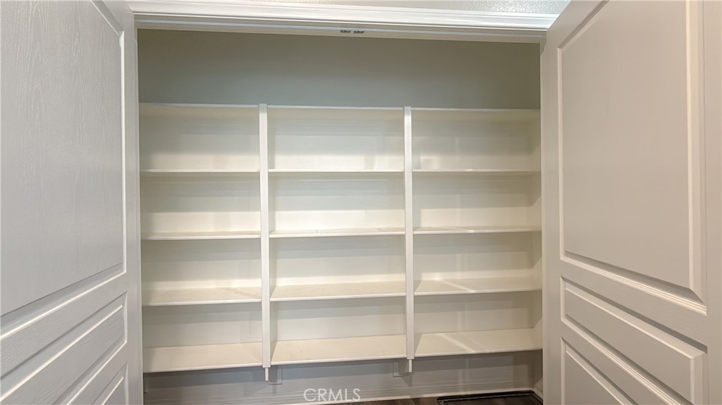 7833 Wild Rye Street Chino, CA 91708 - Photo 7 of 44 a view of walk in closet with empty racks