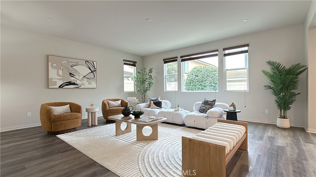7833 Wild Rye Street Chino, CA 91708 - Photo 9 of 44 a living room with furniture and a large window