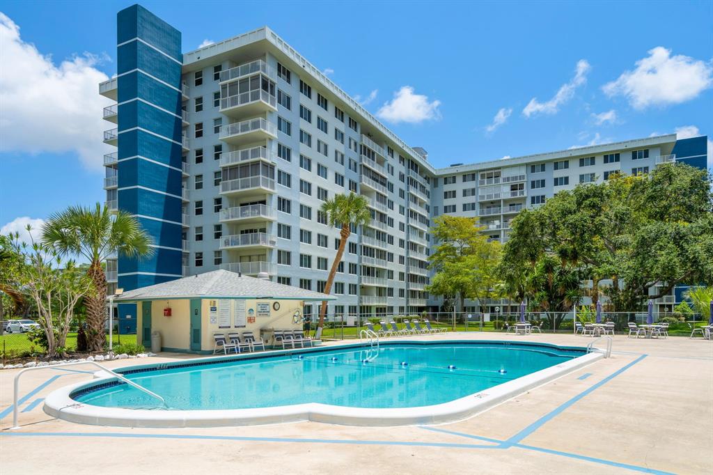4200 Hillcrest Drive, Unit 711 Hollywood, FL 33021 - Photo 21 of 37 a view of a swimming pool with a patio