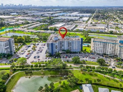 4200 Hillcrest Drive, Unit 711 Hollywood, FL 33021 - Photo 28 of 37 a view of swimming pool with a garden and plants