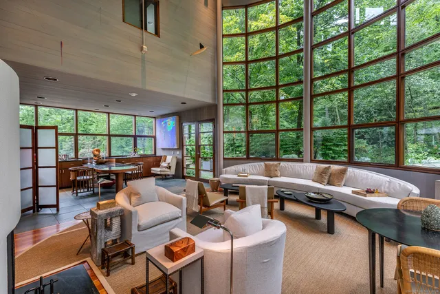 a kitchen with stainless steel appliances kitchen island granite countertop a refrigerator a stove and a sink