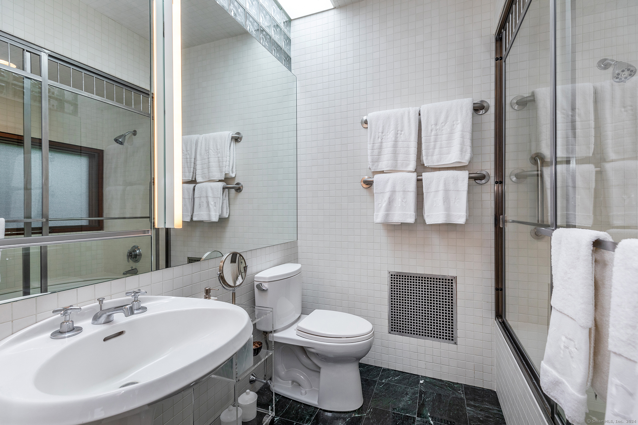 23 Mauwee Brook Road Kent, CT 06757 - Photo 18 of 40 a bathroom with a toilet sink and mirror