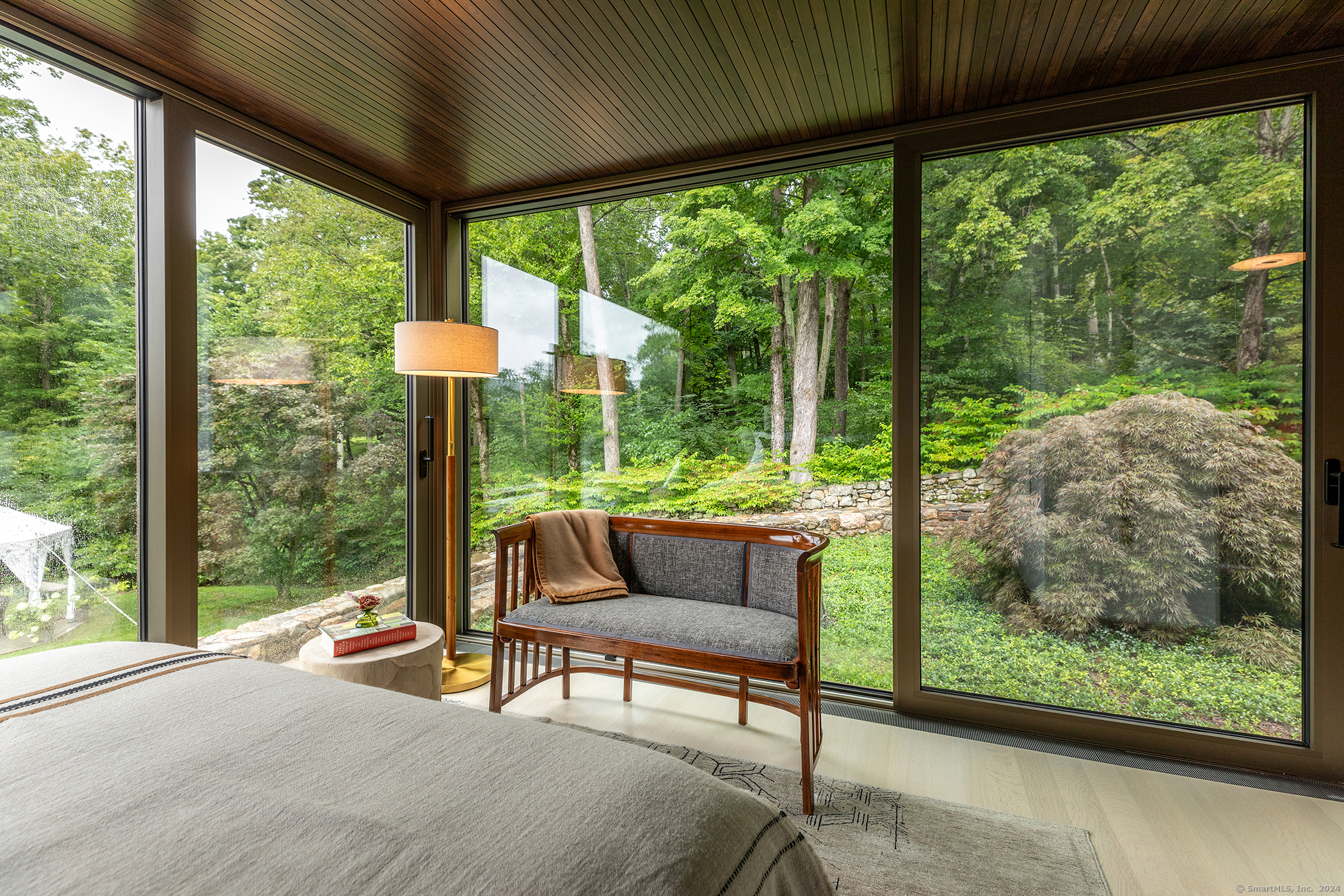 23 Mauwee Brook Road Kent, CT 06757 - Photo 25 of 40 a living room with couch and a floor to ceiling window
