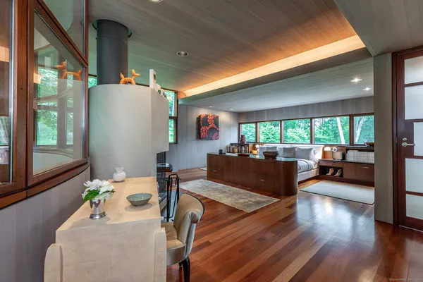 a living room with furniture and a large window