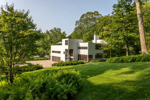 a view of a building with a yard