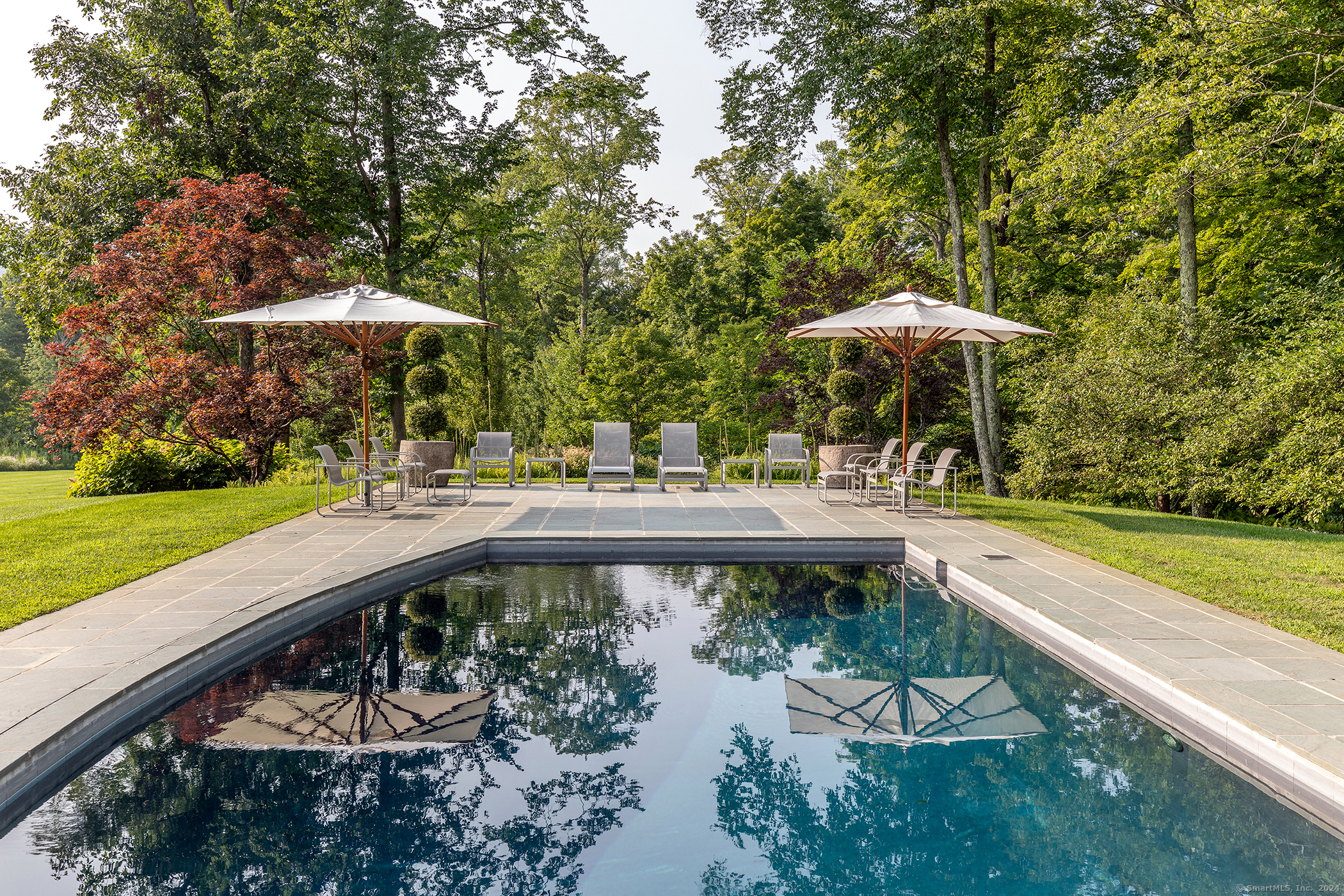 23 Mauwee Brook Road Kent, CT 06757 - Photo 7 of 40 a view of a swimming pool with a patio