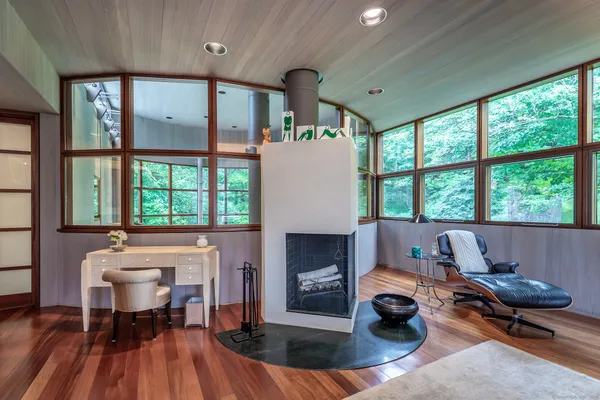 a living room with furniture a window and a fireplace