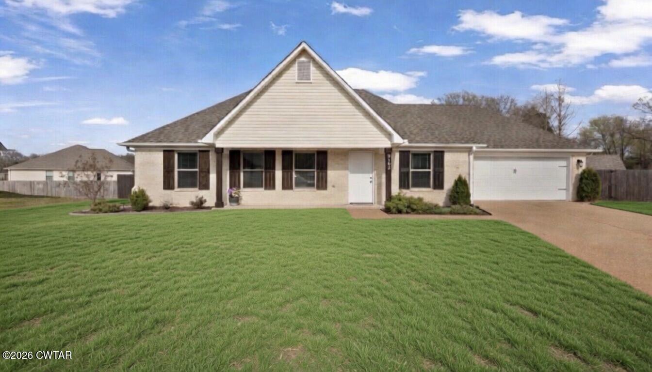 a front view of house with yard barbeque and outdoor seating