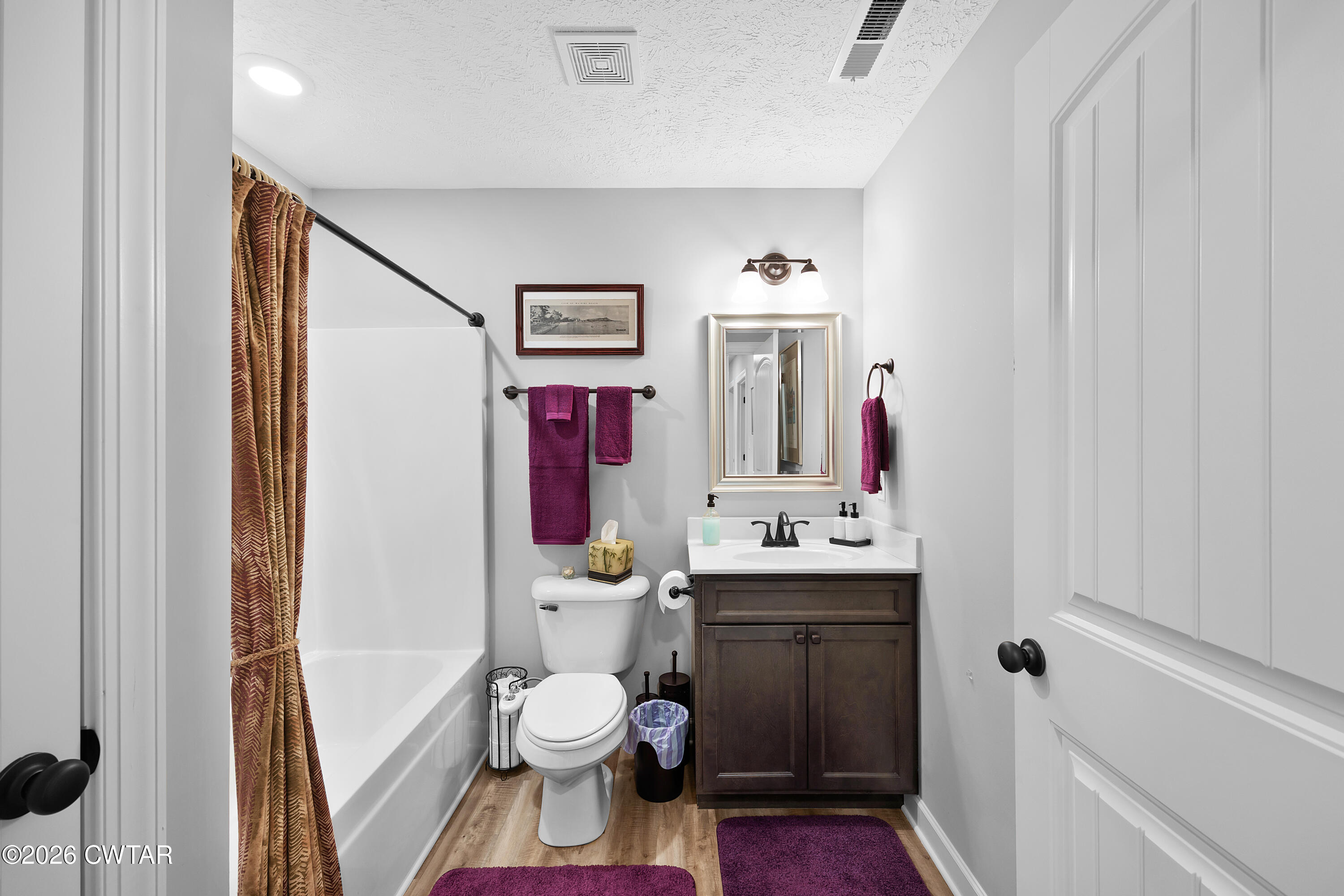 3102 Fawn Ridge Cove Humboldt, TN 38343 - Photo 16 of 20 a bathroom with a toilet sink and mirror