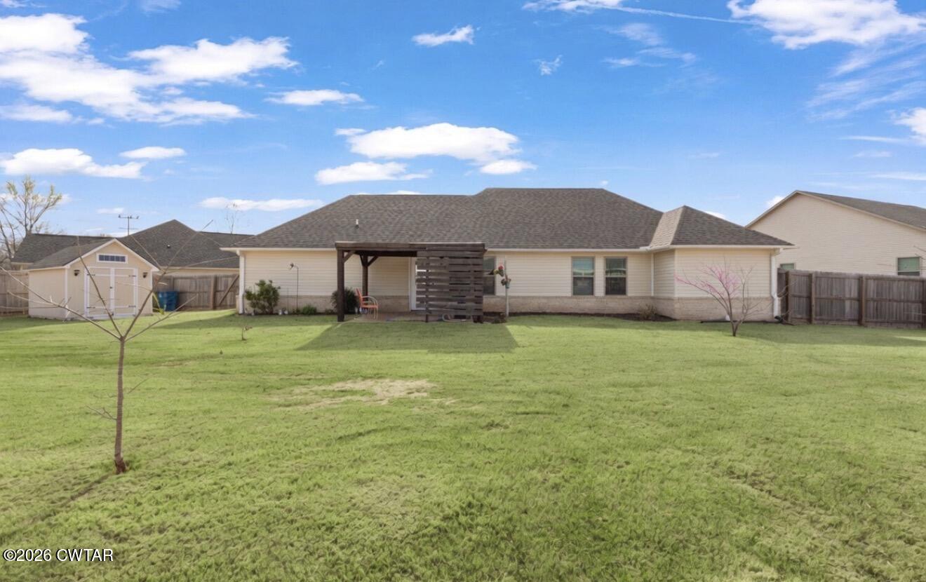 3102 Fawn Ridge Cove Humboldt, TN 38343 - Photo 20 of 20 a front view of a house with a garden