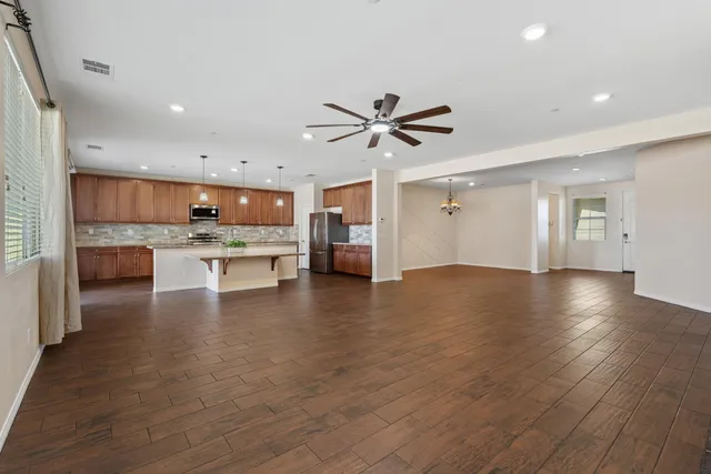 a view of a kitchen with a sink and a stove top oven