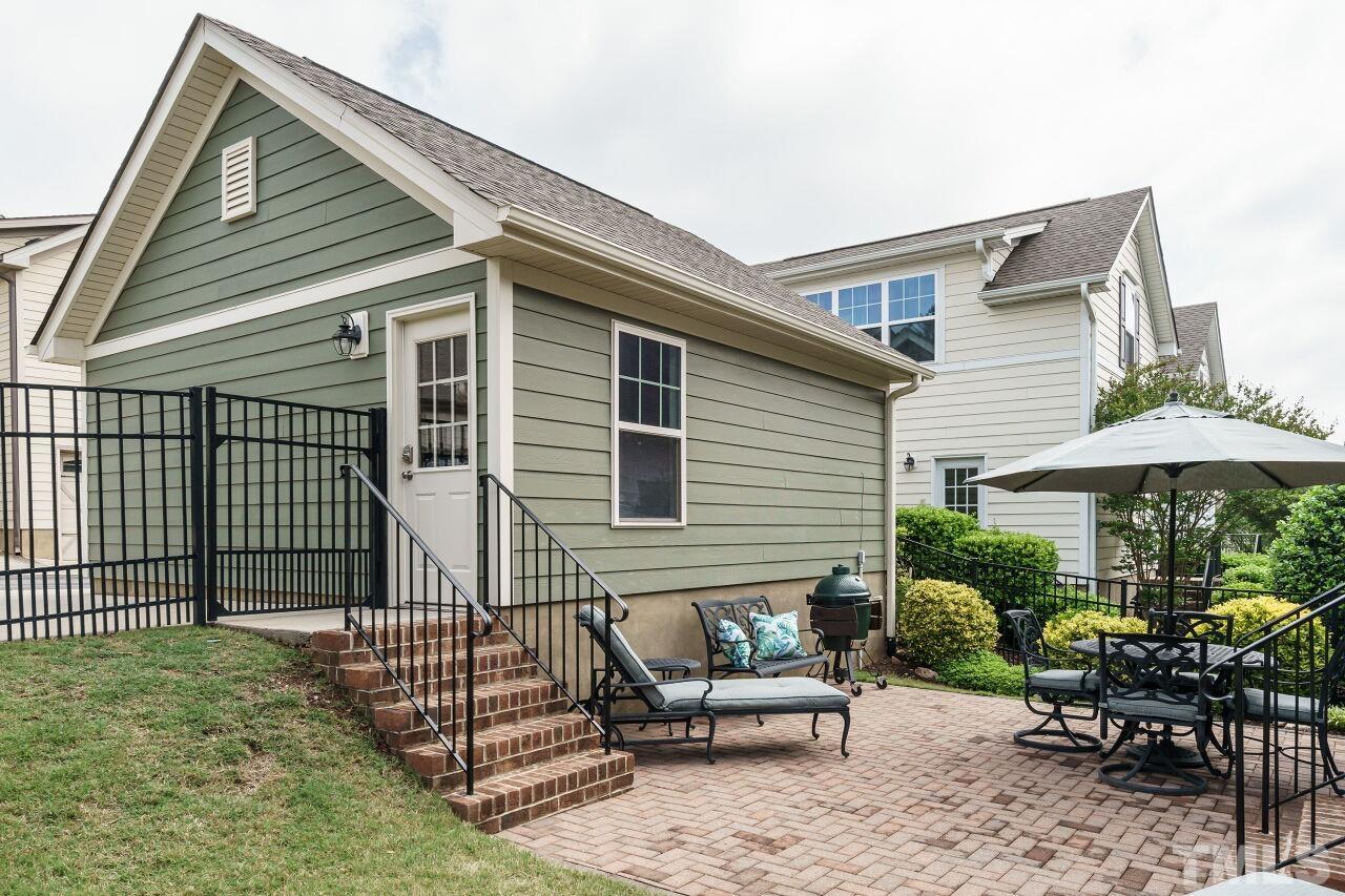 5642 Wade Park Boulevard Raleigh, NC 27607 - Photo 38 of 40 a view of a house with backyard and sitting area