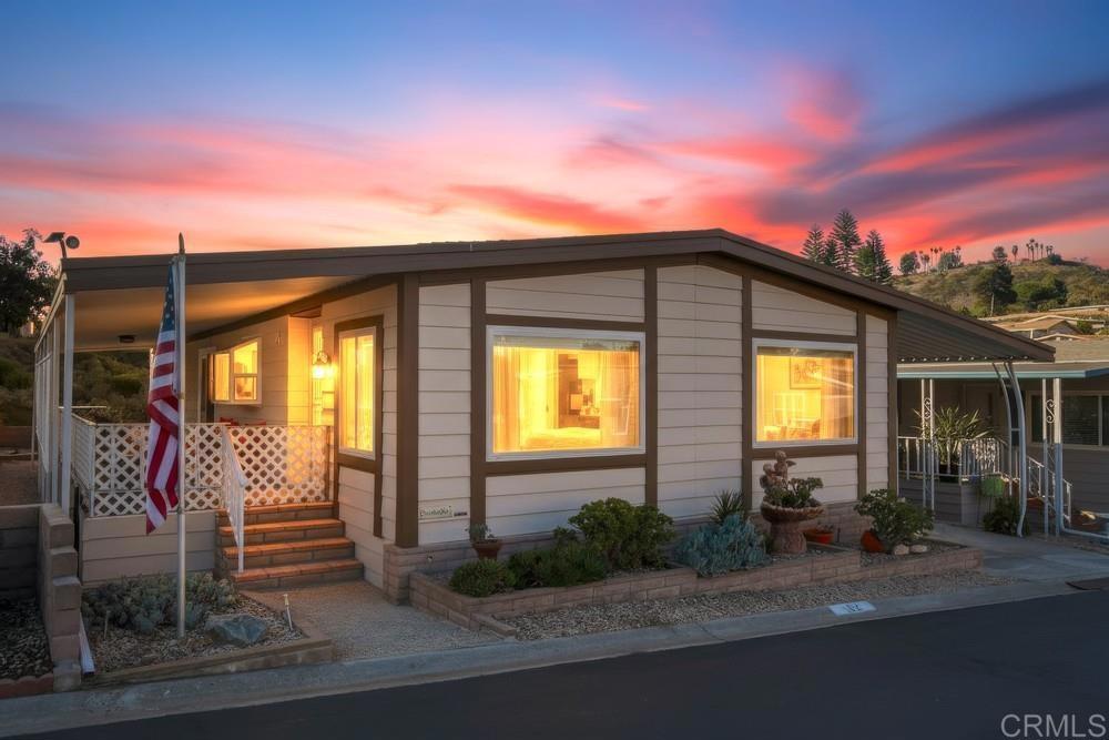 1175 La Moree Road, Unit 52 San Marcos, CA 92078 - Photo 1 of 54 a front view of a house with yard