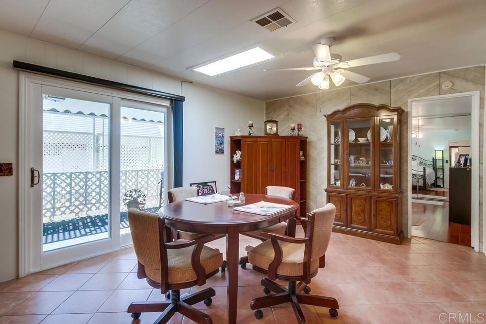 1175 La Moree Road, Unit 52 San Marcos, CA 92078 - Photo 13 of 54 a dining room with furniture and window