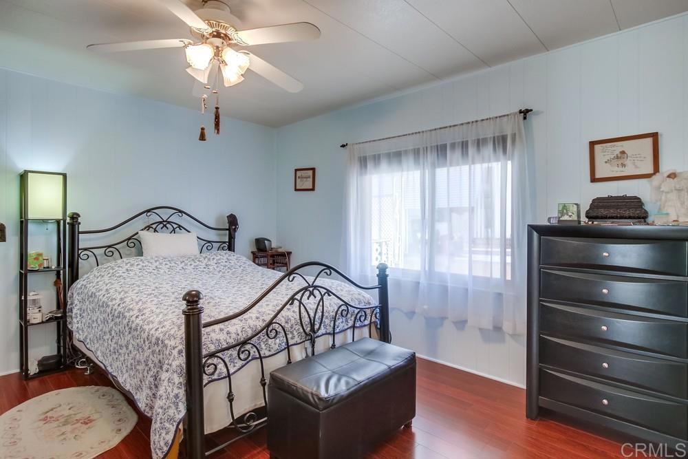 1175 La Moree Road, Unit 52 San Marcos, CA 92078 - Photo 17 of 54 a bedroom with furniture and a window