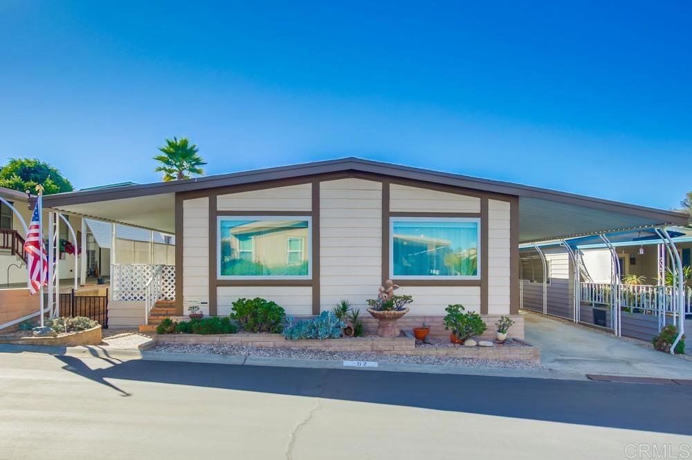 1175 La Moree Road, Unit 52 San Marcos, CA 92078 - Photo 2 of 54 a front view of house with a garden