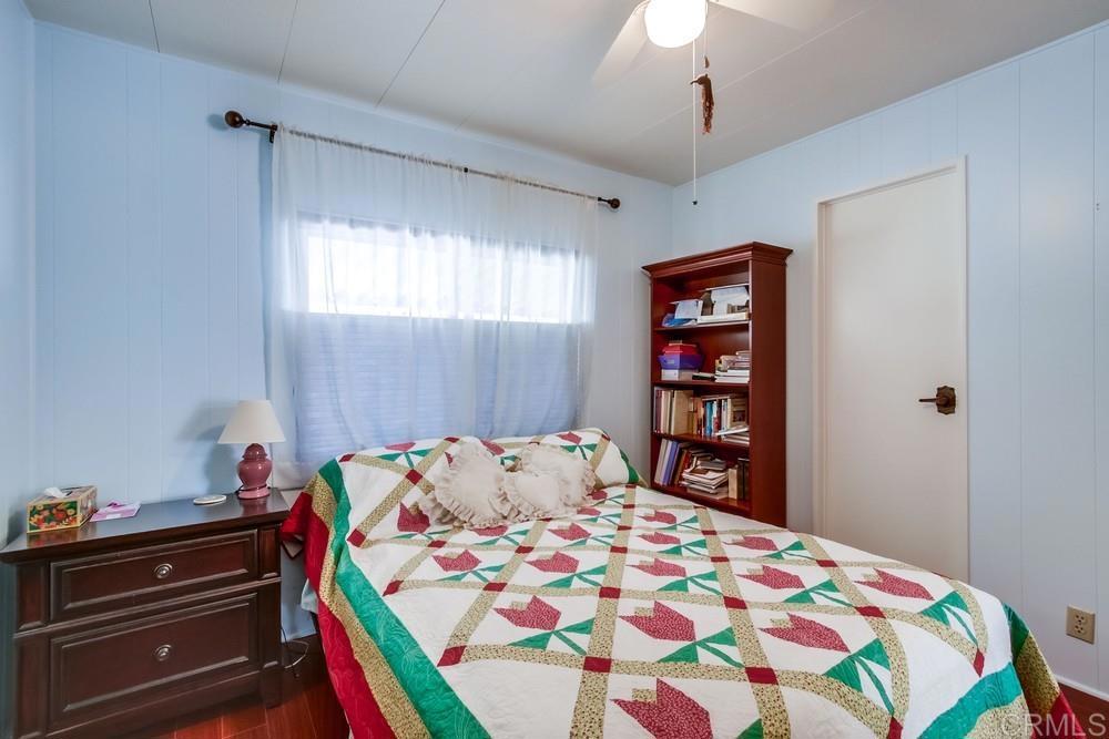 1175 La Moree Road, Unit 52 San Marcos, CA 92078 - Photo 23 of 54 a bedroom with a bed and a bookshelf