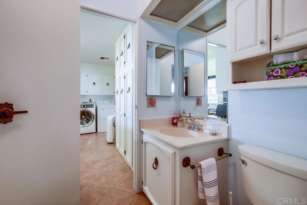 1175 La Moree Road, Unit 52 San Marcos, CA 92078 - Photo 25 of 54 a bathroom with a sink vanity toilet and shower
