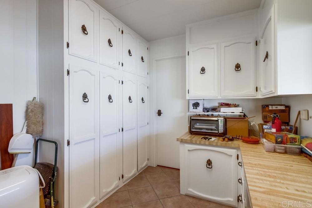 1175 La Moree Road, Unit 52 San Marcos, CA 92078 - Photo 27 of 54 a view of cabinets and wooden floor