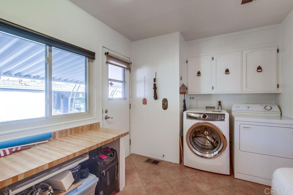 1175 La Moree Road, Unit 52 San Marcos, CA 92078 - Photo 28 of 54 a utility room with sink dryer and washer