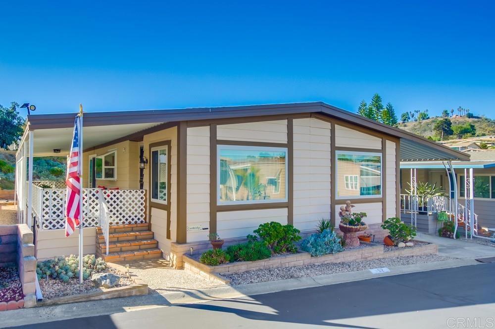 1175 La Moree Road, Unit 52 San Marcos, CA 92078 - Photo 39 of 54 a front view of a house with a yard