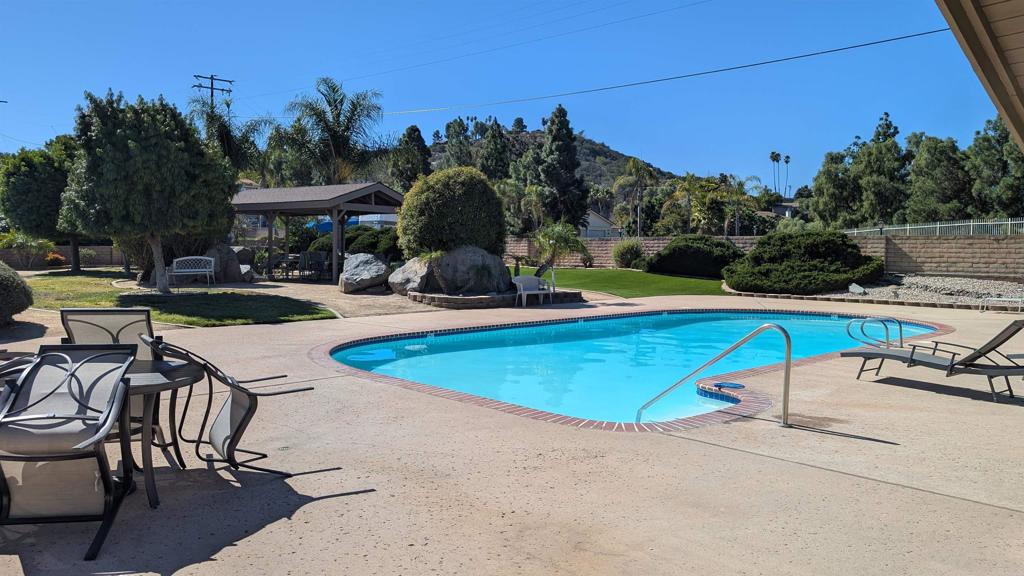 1175 La Moree Road, Unit 52 San Marcos, CA 92078 - Photo 50 of 54 an outdoor space with swimming pool and furniture