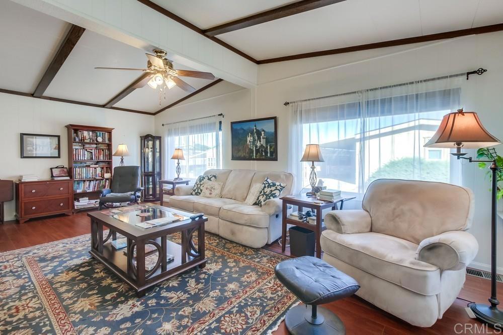 1175 La Moree Road, Unit 52 San Marcos, CA 92078 - Photo 5 of 54 a living room with furniture a rug and a large window