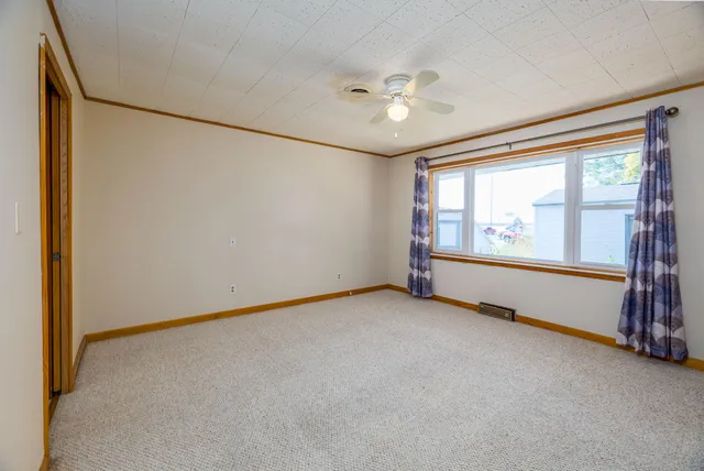 a kitchen with stainless steel appliances a refrigerator a sink dishwasher a stove with wooden cabinets and floor