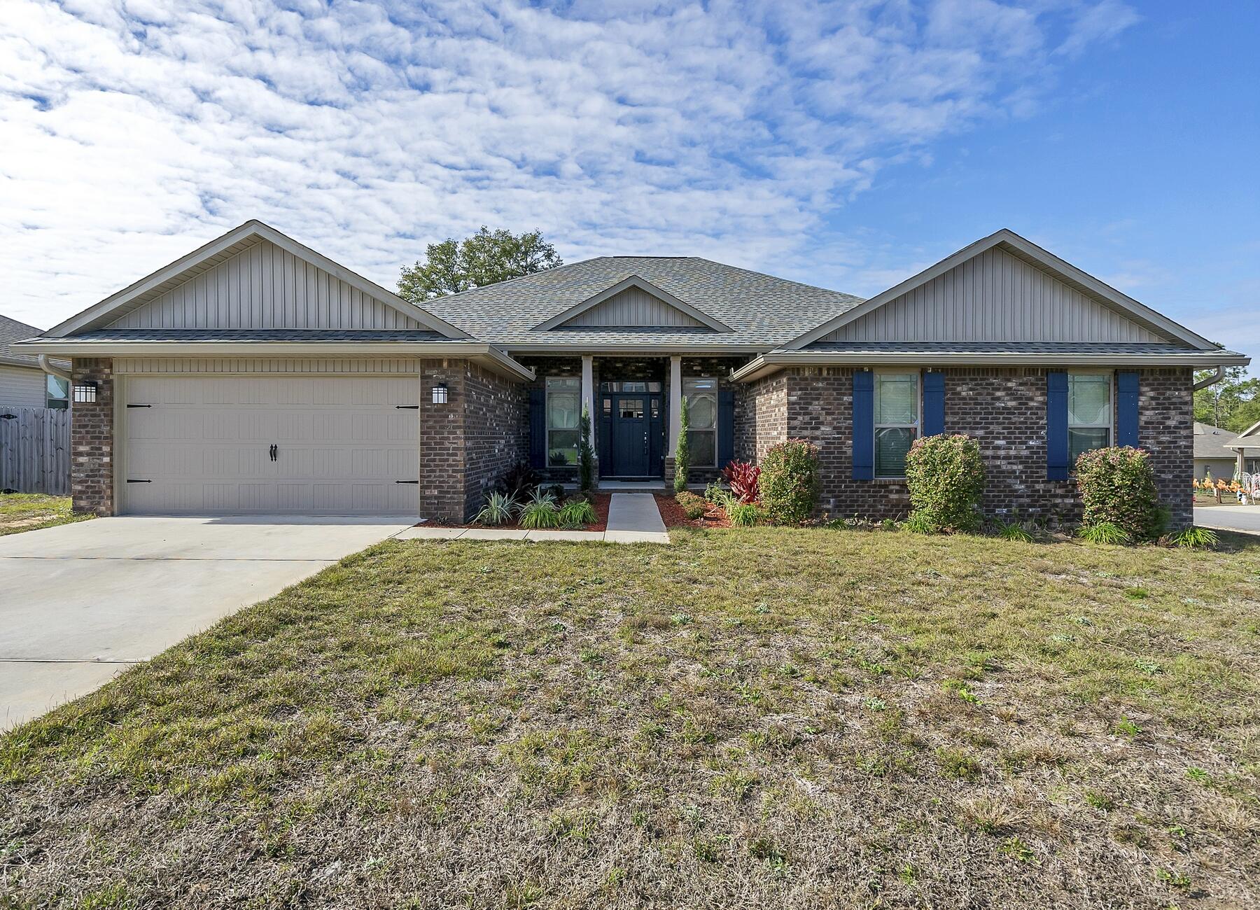 3639 Ranch Drive Crestview, FL 32539 - Photo 12 of 84 front view of a house with a yard