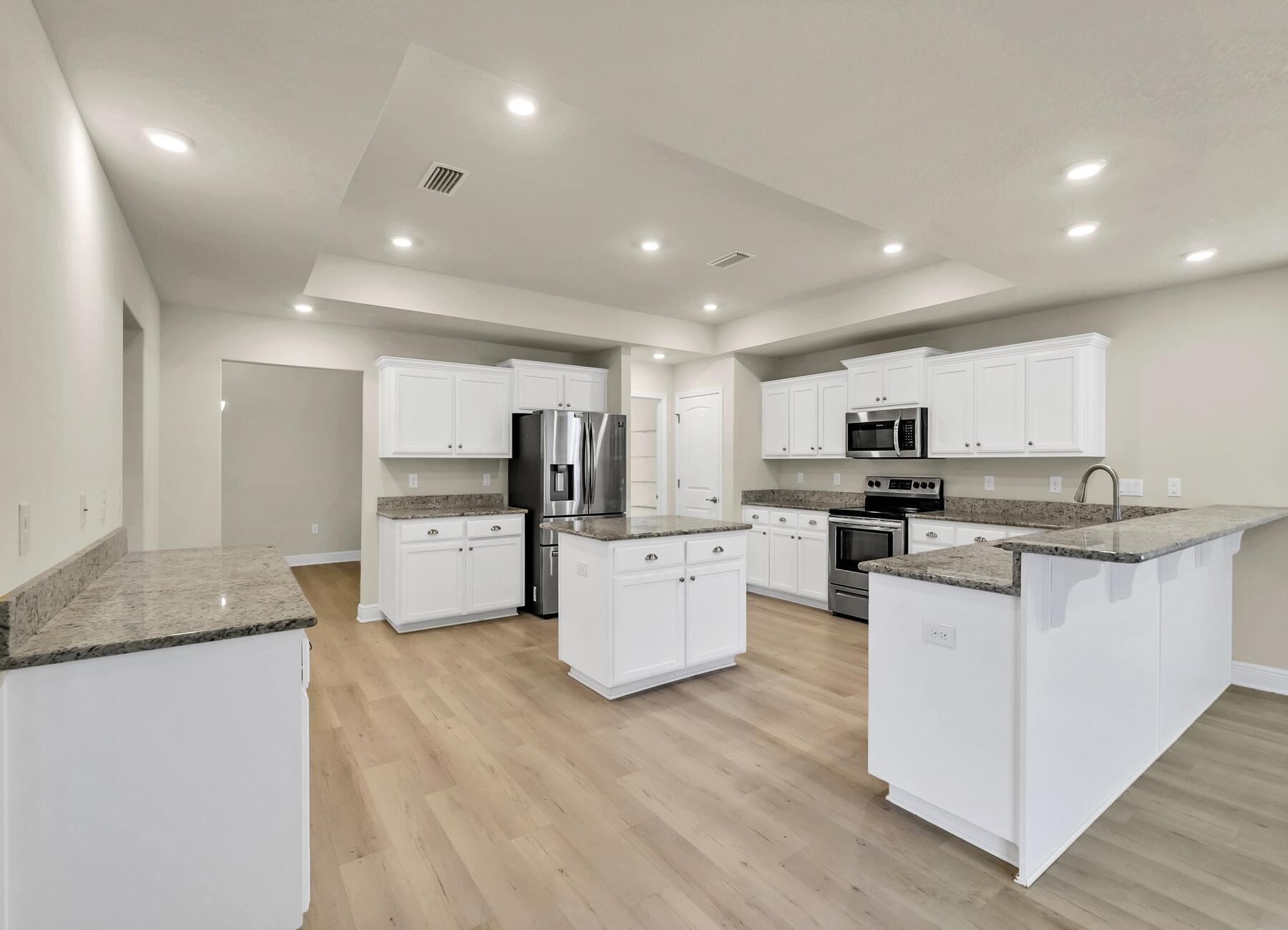 3639 Ranch Drive Crestview, FL 32539 - Photo 23 of 84 a kitchen with counter top space cabinets and stainless steel appliances
