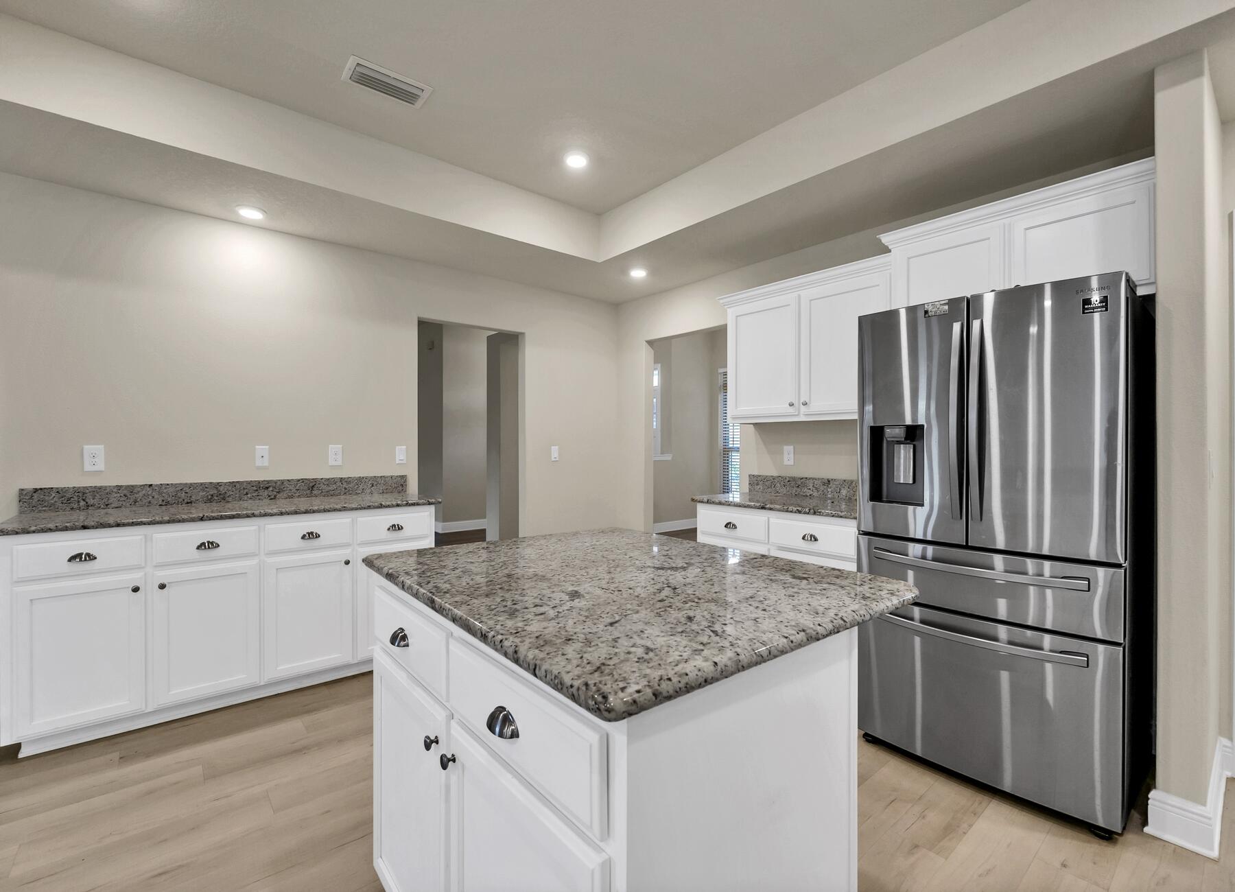 3639 Ranch Drive Crestview, FL 32539 - Photo 28 of 84 a kitchen with stainless steel appliances granite countertop a refrigerator and a stove top oven