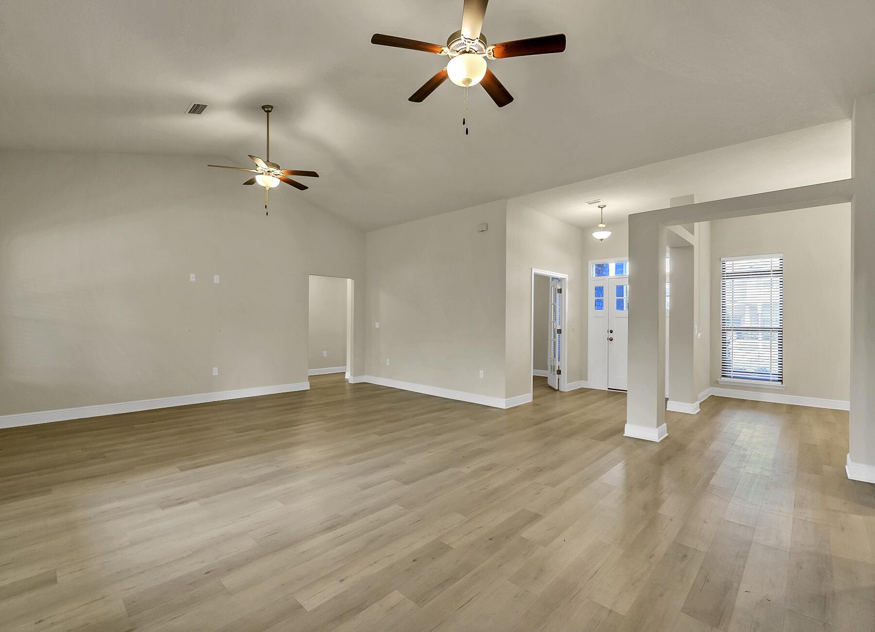 3639 Ranch Drive Crestview, FL 32539 - Photo 41 of 84 an empty room with fan and windows