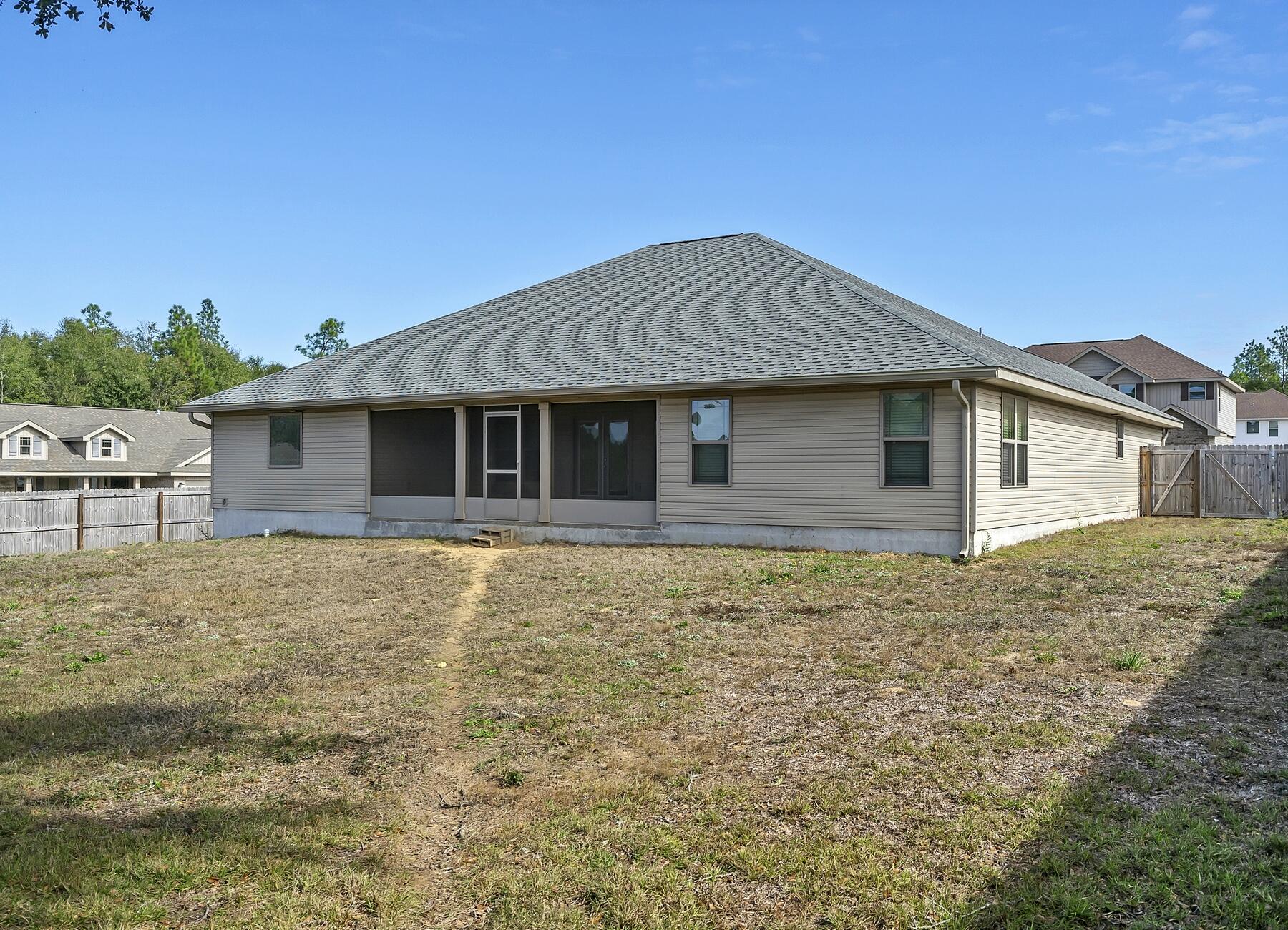 3639 Ranch Drive Crestview, FL 32539 - Photo 5 of 84 a house with yard in front of it