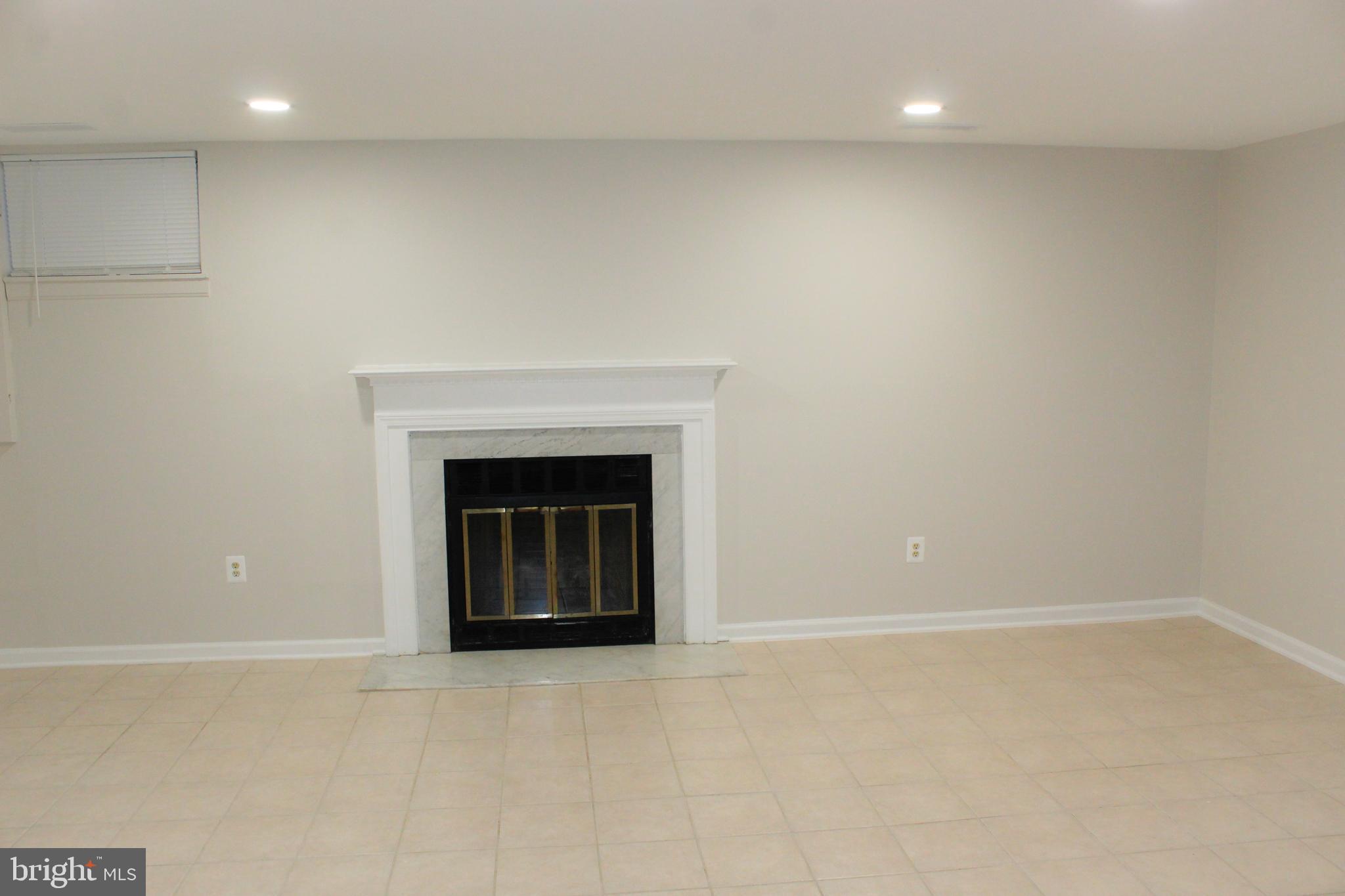 15034 Shamrock Ridge Road Silver Spring, MD 20906 - Photo 54 of 76 Basement with Fireplace