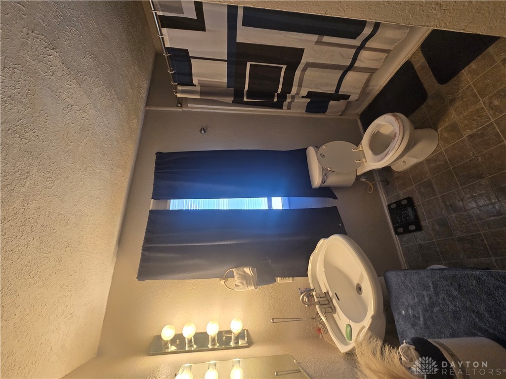 355 Elmhurst Road Dayton, OH 45417 - Photo 11 of 19 This functional bathroom features practical design and essential amenities.