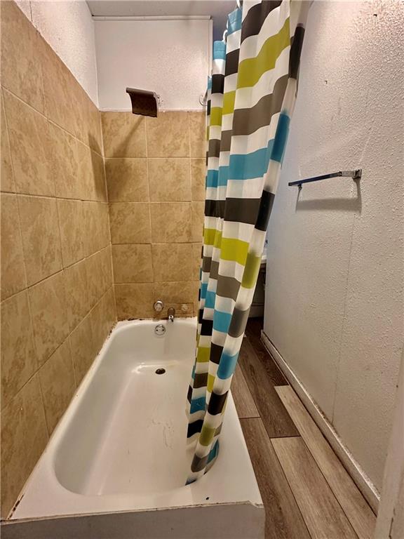 16 3rd Street Charleroi, PA 15022 - Photo 8 of 9 a bathroom with a sink and mirror with bathtub