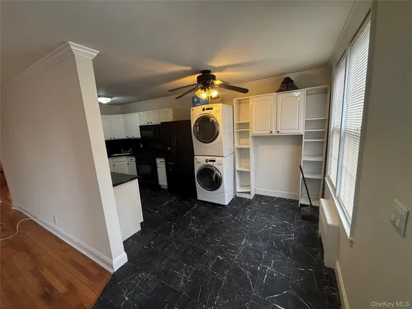 a view of storage and utility room with washer and dryer