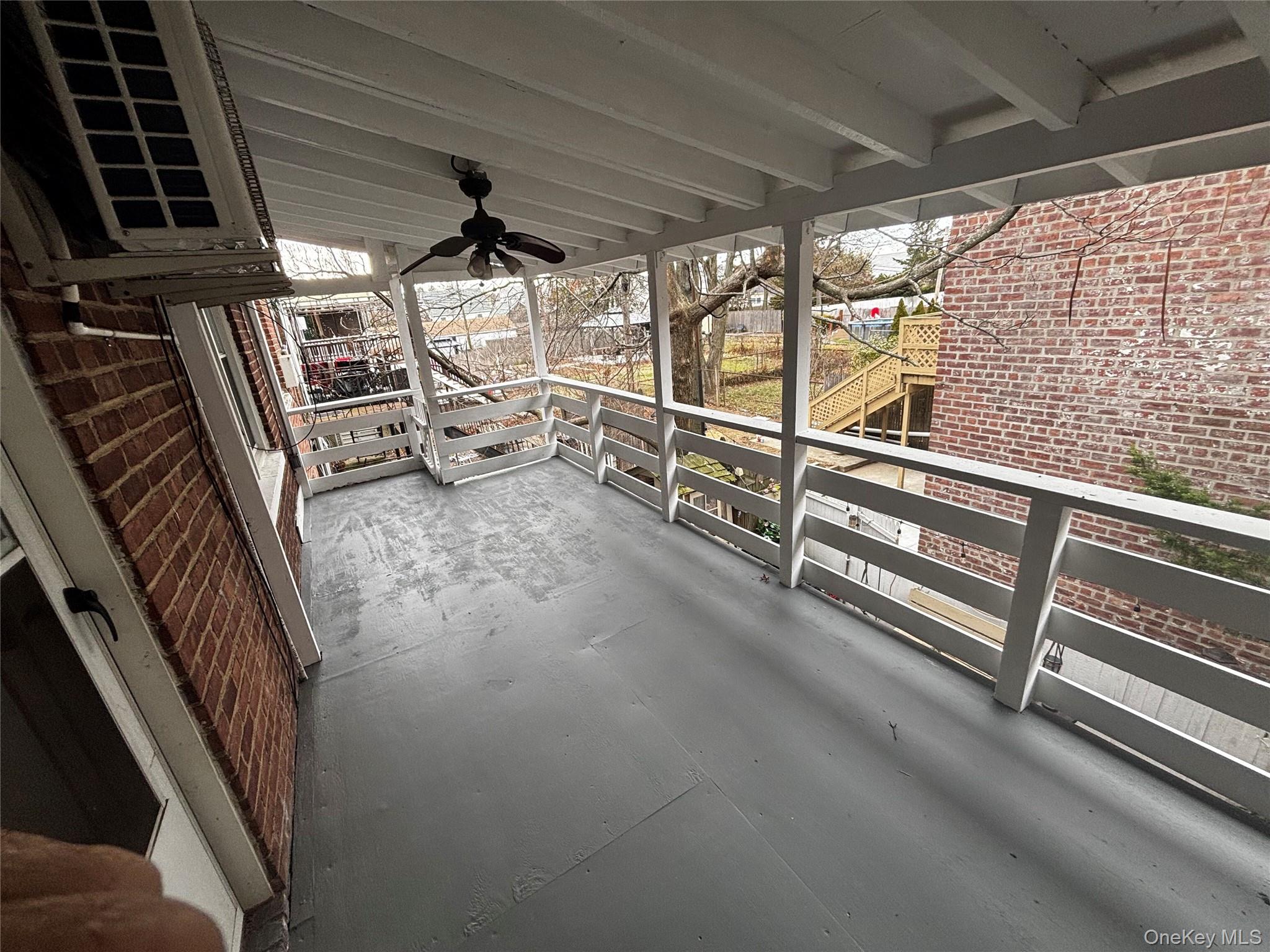 253-29 85th Road Queens, NY 11426 - Photo 7 of 8 a view of an empty room with wooden floor