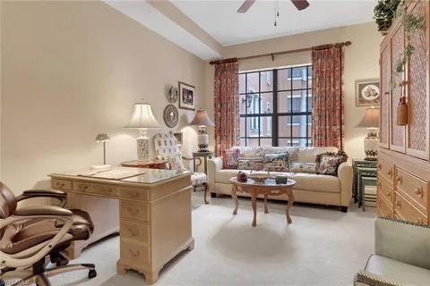 a bedroom with furniture and a chandelier