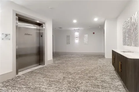 a swimming pool with outdoor seating and plants