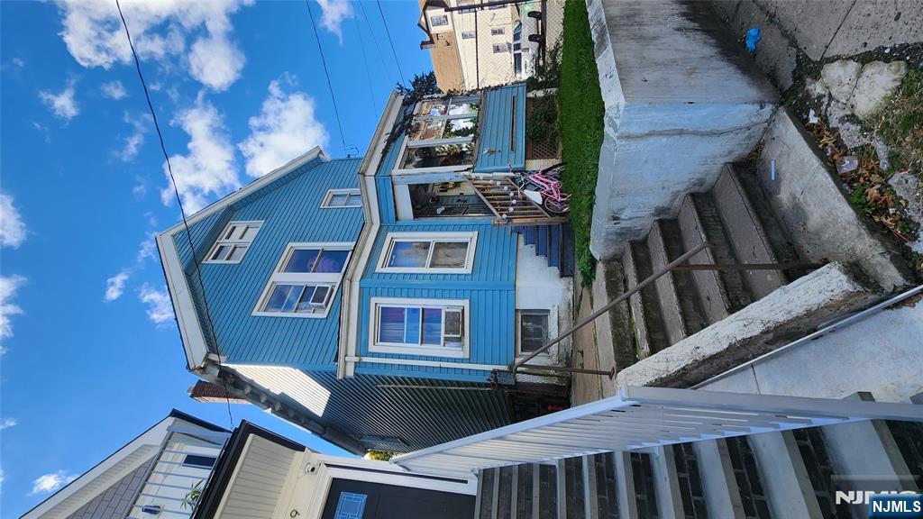 41 Elmwood Avenue Irvington, NJ 07111 - Photo 2 of 2 a front view of a house with a yard