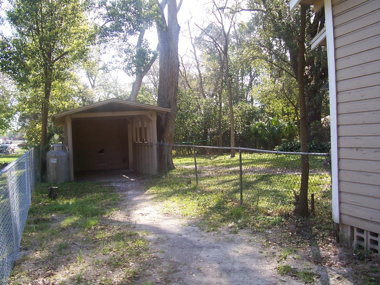 7657 Calvin Street Jacksonville, FL 32208 - Photo 2 of 8 a view of a house with backyard