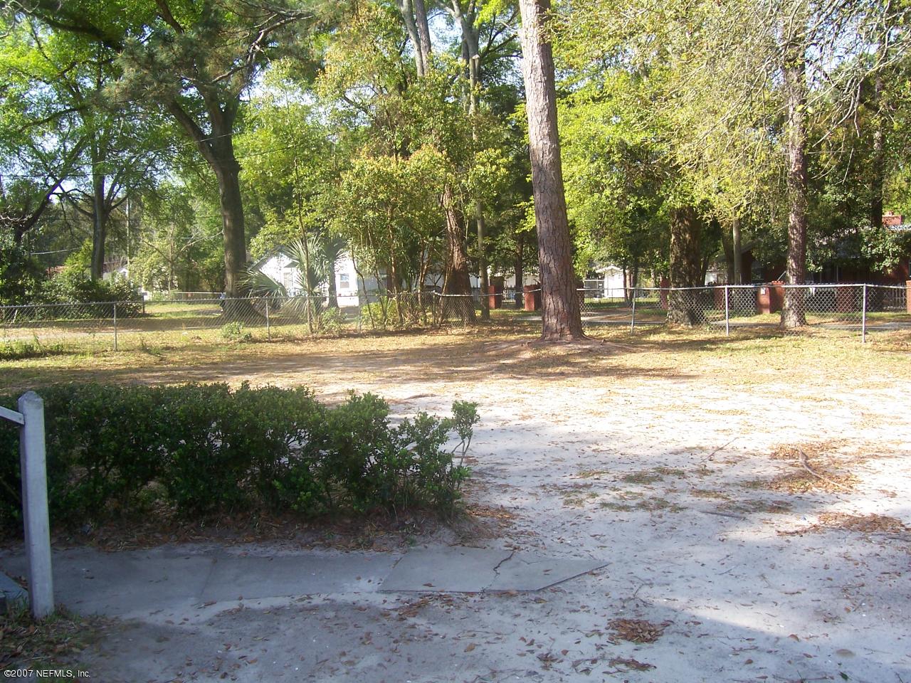 7657 Calvin Street Jacksonville, FL 32208 - Photo 7 of 8 a view of a yard with swimming pool