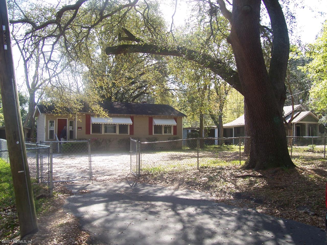 7657 Calvin Street Jacksonville, FL 32208 - Photo 8 of 8 a view of a house with a yard