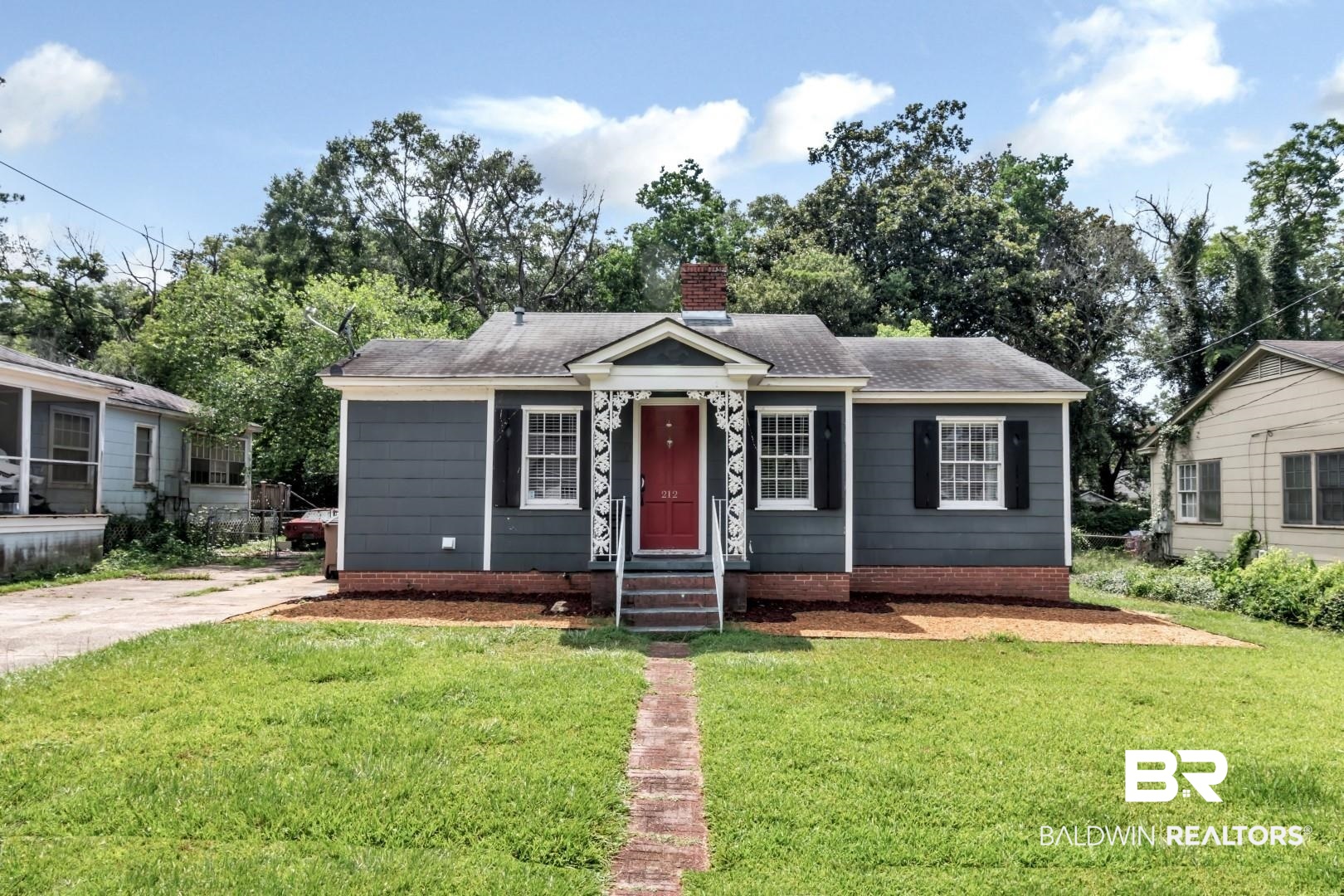 212 Morgan Avenue Mobile, AL 36606 - Photo 1 of 15 Bungalow featuring a front lawn