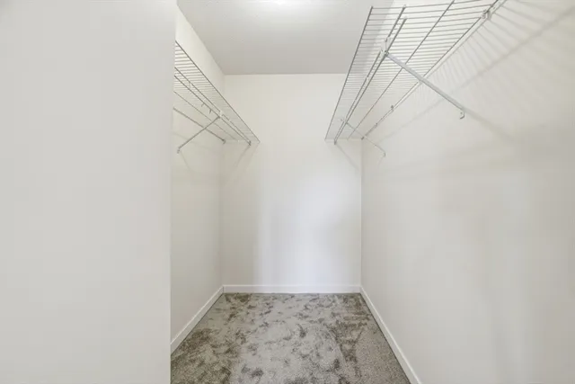 a bathroom with a double vanity sink toilet and mirror