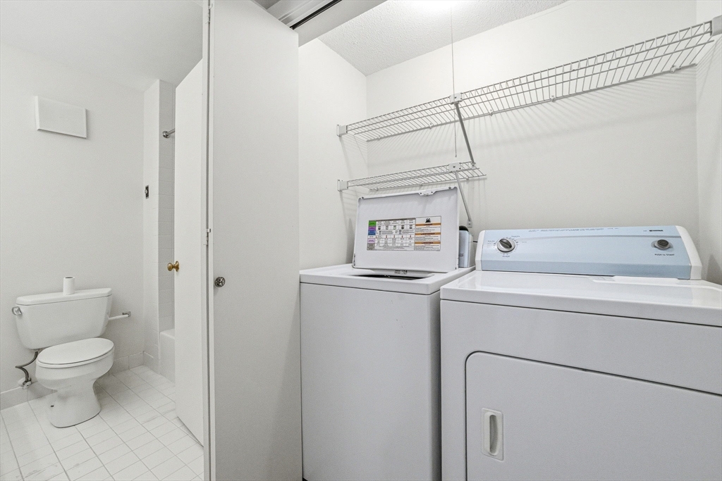 100 Rosemary Way, Unit 324 Needham, MA 02494 - Photo 18 of 27 a utility room with dryer and washer