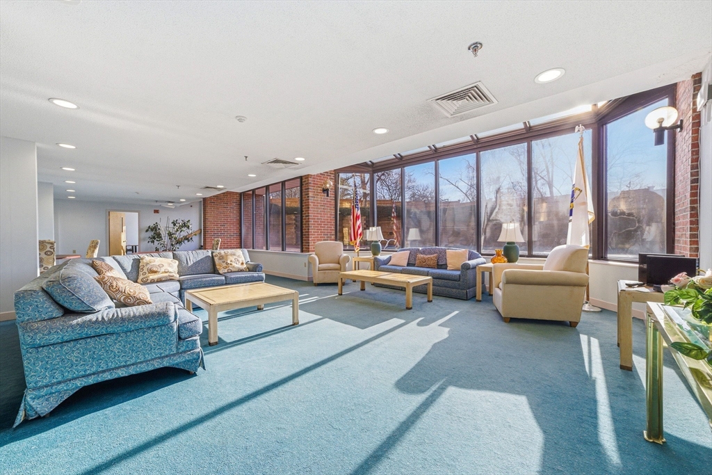 100 Rosemary Way, Unit 324 Needham, MA 02494 - Photo 24 of 27 a living room with furniture and a large window